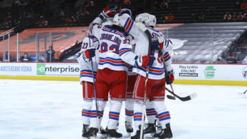 PHILADELPHIA, PA - MARCH 25: Adam Fox #23, Mika Zibanejad #93, and Ryan Strome #16 of the New York Rangers react against the Philadelphia Flyers at the Wells Fargo Center on March 25, 2021 in Philadelphia, Pennsylvania. The Rangers defeated the Flyers 8-3. (Photo by Mitchell Leff/Getty Images)