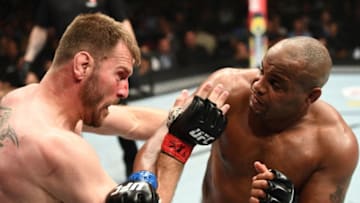 LAS VEGAS, NV - JULY 07: Daniel Cormier punches Stipe Miocic in their UFC heavyweight championship fight during the UFC 226 event inside T-Mobile Arena on July 7, 2018 in Las Vegas, Nevada. (Photo by Josh Hedges/Zuffa LLC/Zuffa LLC via Getty Images)