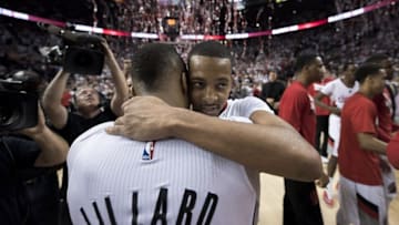 Apr 29, 2016; Portland, OR, USA; Portland Trail Blazers guard Damian Lillard (0) hugs guard CJ McCollum (3) after defeating the Los Angeles Clippers 106-103 in game six of the first round of the NBA Playoffs at Moda Center at the Rose Quarter. Mandatory Credit: Troy Wayrynen-USA TODAY Sports