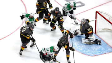 Jamie Benn #14 of the Dallas Stars and Zach Whitecloud #2 of the Vegas Golden Knights battle for the puck during the second period in Game Five. (Photo by Bruce Bennett/Getty Images)