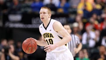 Mar 10, 2016; Indianapolis, IN, USA; Iowa Hawkeyes guard Mike Gesell (10) brings the ball up court against the Illinois Fighting Illini during the Big Ten Conference tournament at Bankers Life Fieldhouse. Mandatory Credit: Brian Spurlock-USA TODAY Sports