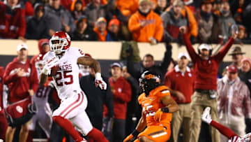 Nov 28, 2015; Stillwater, OK, USA; Oklahoma Sooners running back Joe Mixon (25) runs for a touchdown in the first half against the Oklahoma State Cowboys at Boone Pickens Stadium. Mandatory Credit: Mark J. Rebilas-USA TODAY Sports