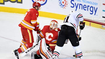 Nov 18, 2016; Calgary, Alberta, CAN; Chicago Blackhawks right wing Marian Hossa (81) scores the game winning goal on Calgary Flames goalie Chad Johnson (31) during the third period at Scotiabank Saddledome. Blackhawks won 3-2. Mandatory Credit: Candice Ward-USA TODAY Sports