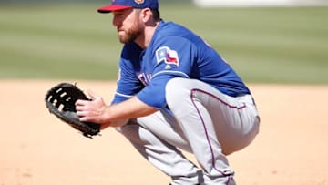 Mar 8, 2016; Mesa, AZ, USA; Texas Rangers first baseman Ike Davis (20) in the first inning during a spring training against the Oakland Athletics at HoHoKam Stadium. Mandatory Credit: Rick Scuteri-USA TODAY Sports
