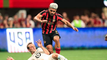 ATLANTA, GA - AUGUST 27: Josef Martinez #7 of Atlanta United battles Chase Gasper #77 of Minnesota United for ball control during the U.S. Open Cup Final at Mercedes-Benz Stadium on August 27, 2019 in Atlanta, Georgia. (Photo by Carmen Mandato/Getty Images)