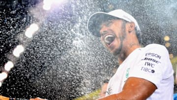 ABU DHABI, UNITED ARAB EMIRATES - NOVEMBER 25: Race winner Lewis Hamilton of Great Britain and Mercedes GP celebrates with his team after the Abu Dhabi Formula One Grand Prix at Yas Marina Circuit on November 25, 2018 in Abu Dhabi, United Arab Emirates. (Photo by Clive Mason/Getty Images)