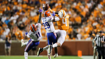 KNOXVILLE, TN - SEPTEMBER 22: Tight end Dominick Wood-Anderson #4 of the Tennessee Volunteers reaches for a pass with Jeawon Taylor #29 of the Florida Gators and Vosean Joseph #11 of the Florida Gators defending during the game between the Florida Gators and Tennessee Volunteers at Neyland Stadium on September 22, 2018 in Knoxville, Tennessee. Florida won the game 47-21. (Photo by Donald Page/Getty Images)