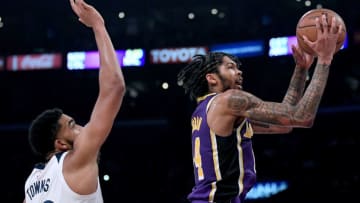 LOS ANGELES, CA - NOVEMBER 07: Brandon Ingram #14 of the Los Angeles Lakers scores on a layup past Karl-Anthony Towns #32 of the Minnesota Timberwolves at Staples Center on November 7, 2018 in Los Angeles, California. NOTE TO USER: User expressly acknowledges and agrees that, by downloading and or using this photograph, User is consenting to the terms and conditions of the Getty Images License Agreement. (Photo by Harry How/Getty Images)