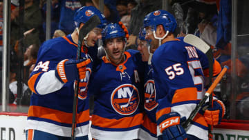 NEW YORK, NEW YORK - NOVEMBER 05: Casey Cizikas #53 of the New York Islanders celebrates his third period goal with Cal Clutterbuck #15, Scott Mayfield #24 and Johnny Boychuk #55 against the Ottawa Senators at Barclays Center on November 05, 2019 in New York City. New York Islanders defeated the Ottawa Senators 4-1. (Photo by Mike Stobe/NHLI via Getty Images)