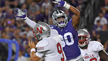 MANHATTAN, KS - AUGUST 31: Defensive end Bronson Massie #90 of the Kansas State Wildcats pressures quarterback Chase Fourcade #9 of the Nicholls State Colonels during the second half at Bill Snyder Family Football Stadium on August 31, 2019 in Manhattan, Kansas. (Photo by Peter G. Aiken/Getty Images)