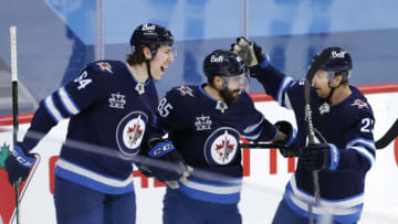 Feb 11, 2021; Winnipeg, Manitoba, CAN; Winnipeg Jets left wing Mathieu Perreault (85) celebrates his third period goal against the Ottawa Senators at Bell MTS Place. Mandatory Credit: James Carey Lauder-USA TODAY Sports