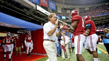 Jan 2, 2014; New Orleans, LA, USA; Alabama Crimson Tide head coach Nick Saban leads his team onto the field for warmups prior to kickoff against the Oklahoma Sooners at the Mercedes-Benz Superdome. Mandatory Credit: Crystal LoGiudice-USA TODAY Sports