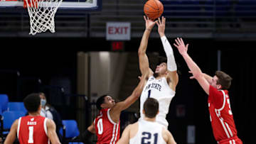 Jan 30, 2021; University Park, Pennsylvania, USA; Penn State Nittany Lions forward Seth Lundy (1) shoots the ball as Wisconsin Badgers guard D'Mitrik Trice (0) defends during the first half at Bryce Jordan Center. Mandatory Credit: Matthew OHaren-USA TODAY Sports