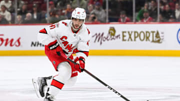 Apr 1, 2023; Montreal, Quebec, CAN; Carolina Hurricanes defenseman Shayne Gostisbehere (41) plays the puck against the Montreal Canadiens during the second period at Bell Centre. Mandatory Credit: David Kirouac-USA TODAY Sports