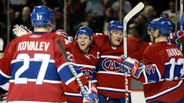 MONTREAL- MARCH 31: Saku Koivu #11 of the Montreal Canadiens celebrates his second period goal with teammates Andrei Markov #79, Alexei Kovalev #27 and Alex Tanguay #13 during the NHL game against the Chicago Blackhawks at the Bell Centre March 31, 2009 in Montreal, Quebec, Canada. (Photo by Richard Wolowicz/Getty Images)