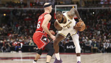 Dec 19, 2021; Chicago, Illinois, USA; Chicago Bulls guard Alex Caruso (6) defends against Los Angeles Lakers forward LeBron James (6) during the second half at United Center. Mandatory Credit: Kamil Krzaczynski-USA TODAY Sports