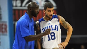 Jul 11, 2015; Las Vegas, NV, USA; Philadelphia 76ers head coach Lloyd Pierce talks with guard Scottie Wilbekin (18) during a free throw attempt in an NBA Summer League game against the Los Angeles Lakers at Thomas & Mack Center. Mandatory Credit: Stephen R. Sylvanie-USA TODAY Sports