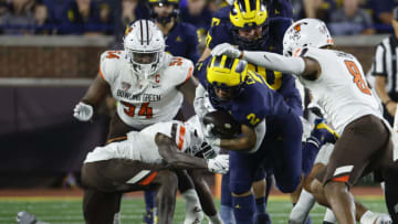Sep 16, 2023; Ann Arbor, Michigan, USA; Michigan Wolverines running back Blake Corum (2) rushes at Bowling Green Falcons cornerback Davon Ferguson (7) in the second half at Michigan Stadium. Mandatory Credit: Rick Osentoski-USA TODAY Sports