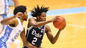 Mar 6, 2021; Chapel Hill, North Carolina, USA; Duke Blue Devils guard DJ Steward (2) looks to pass as North Carolina Tar Heels guard Kerwin Walton (24) defends in the second half at Dean E. Smith Center. Mandatory Credit: Bob Donnan-USA TODAY Sports