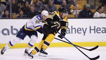 Nov 22, 2016; Boston, MA, USA; Boston Bruins left wing Brad Marchand (63) keeps the puck away from St. Louis Blues center Paul Stastny (26) during the first period at TD Garden. Mandatory Credit: Greg M. Cooper-USA TODAY Sports