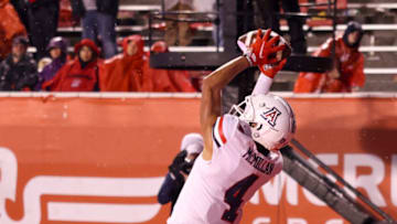 Nov 5, 2022; Salt Lake City, Utah, USA; Arizona Wildcats wide receiver Tetairoa McMillan (4) catches a ball to score a two point conversion against the Utah Utes in the fourth quarter at Rice-Eccles Stadium. Mandatory Credit: Rob Gray-USA TODAY Sports