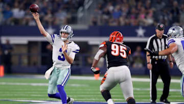 ARLINGTON, TX - AUGUST 18: Mike White #3 of the Dallas Cowboys looks for an open receiver against Eddy Wilson #95 of the Cincinnati Bengals in the fourth quarter at AT&T Stadium on August 18, 2018 in Arlington, Texas. (Photo by Tom Pennington/Getty Images)