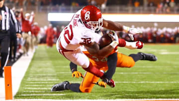 Nov 28, 2015; Stillwater, OK, USA; Oklahoma Sooners running back Samaje Perine dives into the end zone for a touchdown against the Oklahoma State Cowboys in the second quarter at Boone Pickens Stadium. Mandatory Credit: Mark J. Rebilas-USA TODAY Sports