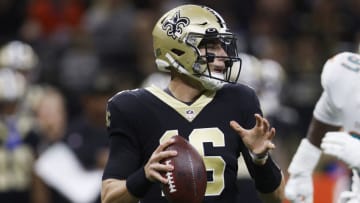 NEW ORLEANS, LOUISIANA - DECEMBER 27: Ian Book #16 of the New Orleans Saints looks to pass during the first quarter against the Miami Dolphins at Caesars Superdome on December 27, 2021 in New Orleans, Louisiana. (Photo by Chris Graythen/Getty Images)