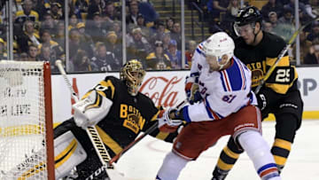Nov 5, 2016; Boston, MA, USA; Boston Bruins goalie Tuukka Rask (40) makes a save on New York Rangers right wing Rick Nash (61) while defenseman Brandon Carlo (25) defends during the second period at TD Garden. Mandatory Credit: Bob DeChiara-USA TODAY Sports