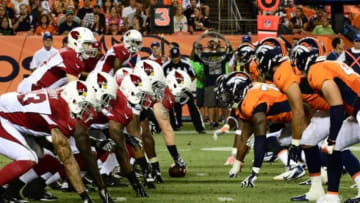 Aug 29, 2013; Denver, CO, USA; Arizona Cardinals quarterback Ryan Lindley (14) prepares to take a snap during the preseason game against the Arizona Cardinals at Sports Authority Field. The Cardinals defeated the Broncos 32-24. Mandatory Credit: Ron Chenoy-USA TODAY Sports