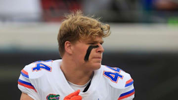 Florida Gators linebacker Jack Pyburn (44) beats his chest after praying before the first quarter of an NCAA football game Saturday, Oct. 29, 2022 at TIAA Bank Field in Jacksonville. The Georgia Bulldogs outlasted the Florida Gators 42-20. [Corey Perrine/Florida Times-Union]Flgai 102922 Florida Vs Georgia 50