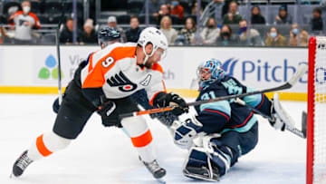 Dec 29, 2021; Seattle, Washington, USA; Philadelphia Flyers defenseman Ivan Provorov (9) scores a goal against Seattle Kraken goaltender Philipp Grubauer (31) during overtime at Climate Pledge Arena. Mandatory Credit: Joe Nicholson-USA TODAY Sports