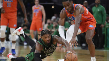 Nov 20, 2021; Boston, Massachusetts, USA; Boston Celtics guard Marcus Smart (36) dives for a loose ball in front of Oklahoma City Thunder guard Shai Gilgeous-Alexander (2) during the second half at TD Garden. Mandatory Credit: Bob DeChiara-USA TODAY Sports