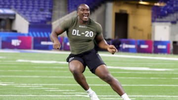 INDIANAPOLIS, INDIANA - MARCH 02: Defensive lineman Adetomiwa Adebawore of Northwestern participates in a drill during the NFL Combine at Lucas Oil Stadium on March 02, 2023 in Indianapolis, Indiana. (Photo by Stacy Revere/Getty Images)