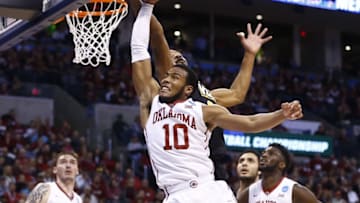 Mar 20, 2016; Oklahoma City, OK, USA; Virginia Commonwealth Rams guard Jordan Burgess (20) and Oklahoma Sooners guard Jordan Woodard (10) jump for the ball during the first half in the second round of the 2016 NCAA Tournament at Chesapeake Energy Arena. Mandatory Credit: Kevin Jairaj-USA TODAY Sports