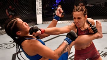LAS VEGAS, NV - JUNE 26: (R-L) Antonina Shevchenko of Kyrgyzstan punches Jaimee Nievera in their women's flyweight bout during Dana White's Tuesday Night Contender Series at the TUF Gym on June 26, 2018 in Las Vegas, Nevada. (Photo by Jeff Bottari/DWTNCS LLC)