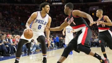 Jan 16, 2016; Philadelphia, PA, USA; Philadelphia 76ers center Jahlil Okafor (8) dribbles against the defense of Portland Trail Blazers forward Maurice Harkless (4) during the second half at Wells Fargo Center. The Philadelphia 76ers won 114-89. Mandatory Credit: Bill Streicher-USA TODAY Sports