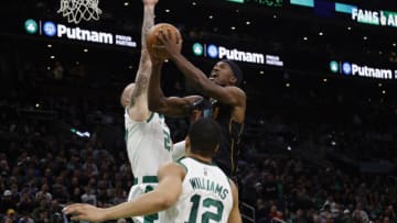 Jimmy Butler #22 of the Miami Heat goes to the basket against the Boston Celtics (Photo By Winslow Townson/Getty Images)
