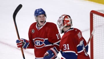 Feb 28, 2015; Montreal, Quebec, CAN; Montreal Canadiens forward Brendan Gallagher (11) celebrates the victory over the Toronto Maple Leafs with teammate goalie Carey Price (31) at the Bell Centre. Mandatory Credit: Eric Bolte-USA TODAY Sports