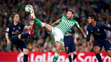 SEVILLE, SPAIN - MARCH 08: Loren Moron of Real Betis Balompie competes for the ball with Luka Modric and Raphael Varane of Real Madrid CF during the Liga match between Real Betis Balompie and Real Madrid CF at Estadio Benito Villamarin on March 08, 2020 in Seville, Spain. (Photo by Mateo Villalba/Quality Sport Images/Getty Images)
