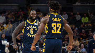 Feb 16, 2022; Indianapolis, Indiana, USA; Indiana Pacers guard Lance Stephenson (6) and guard Terry Taylor (32) celebrate a made basket in the second half against the Washington Wizards at Gainbridge Fieldhouse. Mandatory Credit: Trevor Ruszkowski-USA TODAY Sports