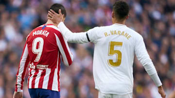 MADRID, SPAIN - FEBRUARY 01: Alvaro Morata of Atletico de Madrid is consoled by Raphael Varane of Real Madrid during the Liga match between Real Madrid CF and Club Atletico de Madrid at Estadio Santiago Bernabeu on February 01, 2020 in Madrid, Spain. (Photo by Quality Sport Images/Getty Images)