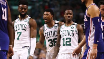 BOSTON, MA - MAY 9: Marcus Smart #36 of the Boston Celtics, center, talks with teammates Jaylen Brown #7 and Terry Rozier #12 during Game Five of the Eastern Conference Second Round of the 2018 NBA Playoffs at TD Garden on May 9, 2018 in Boston, Massachusetts. The Celtics defeat the 76ers 114-112 to advance to the Eastern Conference Finals. (Photo by Maddie Meyer/Getty Images)