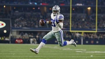 Dec 26, 2016; Arlington, TX, USA; Dallas Cowboys running back Ezekiel Elliott (21) runs for a touchdown in the third quarter against the Detroit Lions at AT&T Stadium. Mandatory Credit: Tim Heitman-USA TODAY Sports