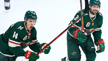 Joel Eriksson Ek, left, agreed to an 8-year extension with the Minnesota Wild after a season in which he set career highs in both goals and points.(Photo by Harrison Barden/Getty Images)