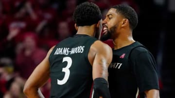 Cincinnati Bearcats guards Mika Adams-Woods and David DeJulius against Xavier Musketeers at Fifth Third Arena. The Enquirer.