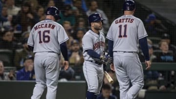 SEATTLE, WA - APRIL 18: Brian McCann #16 of the Houston Astros and Evan Gattis #11 of the Houston Astros are congratulated by Jose Altuve #27 of the Houston Astros after scoring runs two-run double by George Springer #4 of the Houston Astros off of relief pitcher Nick Vincent #50 of the Seattle Mariners during the seventh inning of a game at Safeco Field on April 18, 2018 in Seattle, Washington. (Photo by Stephen Brashear/Getty Images)