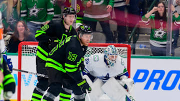 Mar 26, 2022; Dallas, Texas, USA; Vancouver Canucks goaltender Thatcher Demko (35) loses his stick as he defends against Dallas Stars defenseman Esa Lindell (23) and center Joe Pavelski (16) during the third period at the American Airlines Center. Mandatory Credit: Jerome Miron-USA TODAY Sports