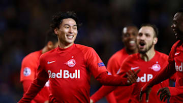 GENK, BELGIUM - NOVEMBER 27: Takumi Minamino of RB Salzburg celebrates scoring his teams second goal of the game with team mates during the UEFA Champions League group E match between KRC Genk and RB Salzburg at Luminus Arena on November 27, 2019 in Genk, Belgium. (Photo by Dean Mouhtaropoulos/Getty Images)