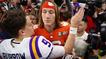 Jan 13, 2020; New Orleans, Louisiana, USA; Clemson Tigers quarterback Trevor Lawrence (right) greets LSU Tigers quarterback Joe Burrow following the College Football Playoff national championship game at Mercedes-Benz Superdome. Mandatory Credit: Mark J. Rebilas-USA TODAY Sports